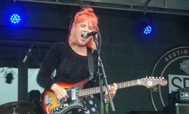 LISTEN: Jennifer Clavin of Bleached Releases Acoustic Covers For "Bonzo Goes To Bitpurg” By The Ramones And "Eve Of Destruction" By Barry McGuire