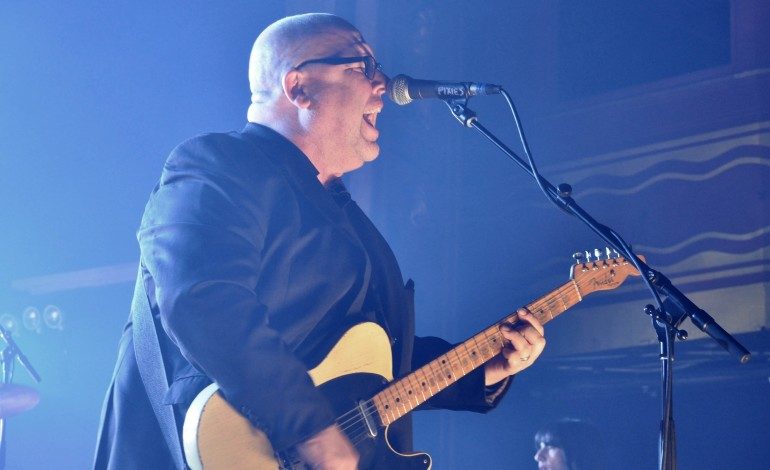Pixies Release Hallucinatory Video Featuring a Hell Hound-Driven Hearse in New Video for “On Graveyard Hill”